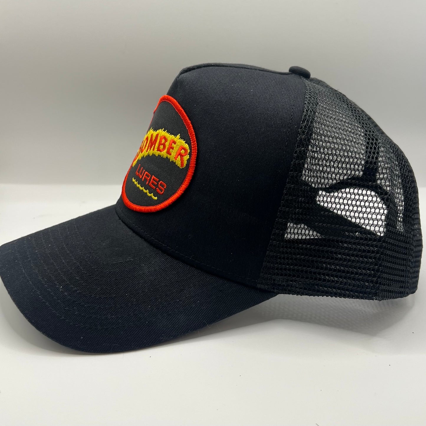 Bomber Lures Patch Cap | Black Trucker Snapback