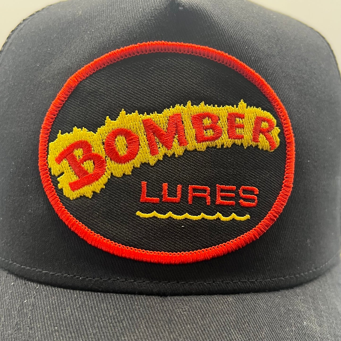 Bomber Lures Patch Cap | Black Trucker Snapback