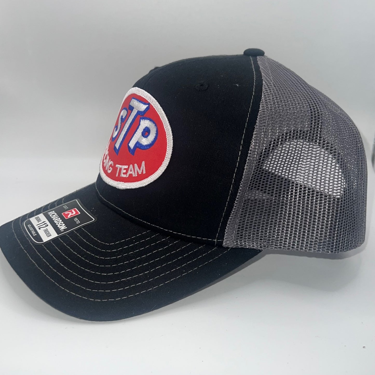 STP Racing Team Patch Cap – Richardson 112 Black/Charcoal Snapback Trucker